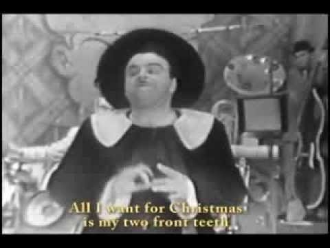 Текст песни  - All I Want For Christmas (My Two Front Teeth)